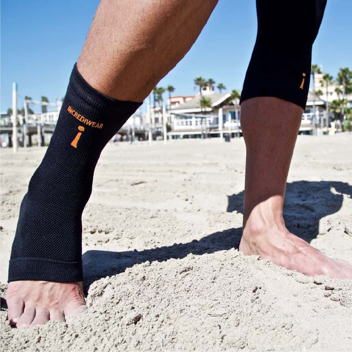 athlete wearing Incrediwear black ankle sleeve