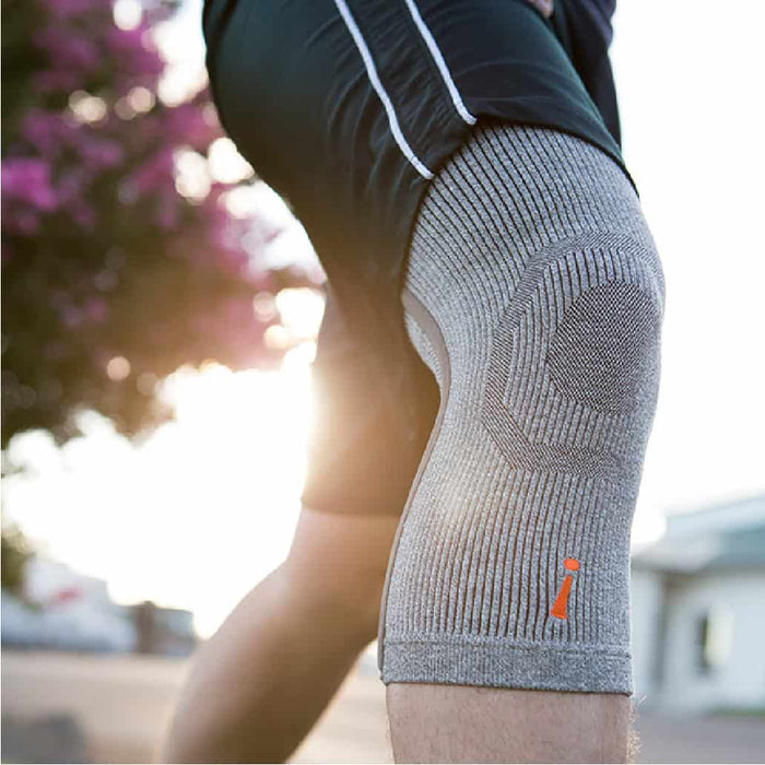 athlete wearing Incrediwear grey knee sleeve